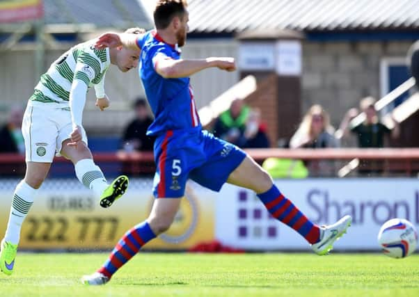 Celtic's Leigh Griffiths (left) finds the corner of the net for an early opener. Picture: SNS