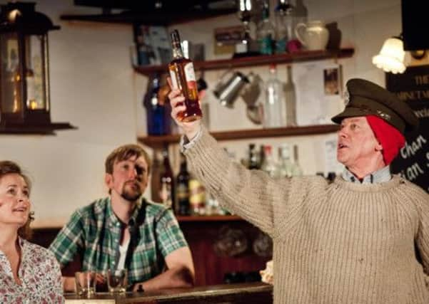 From left, Julie Hale, Calum MacDonald and Iain Macare in the reprise of Whisky Galore, which will have English subtitles. Picture: Drew Farrell