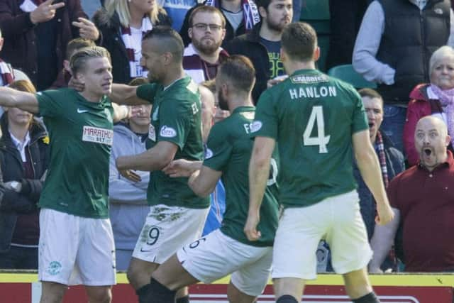 Hibernian's Jason Cummings celebrates scoring during the Edinburgh derby. Picture: PA