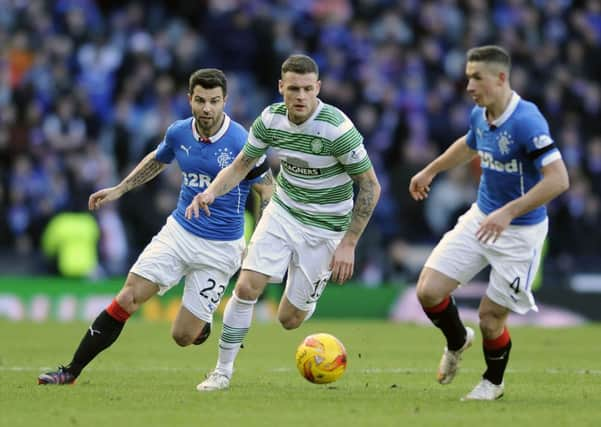 Anthony Stokes shields the ball from Fraser Aird and Richard Foster of Rangers. Picture: John Devlin