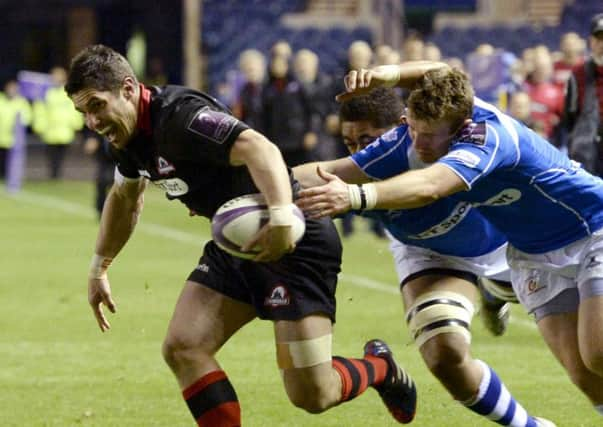 Edinburghs Phil Burleigh storms clear during the capital sides European Challenge Cup victory. Picture: SNS