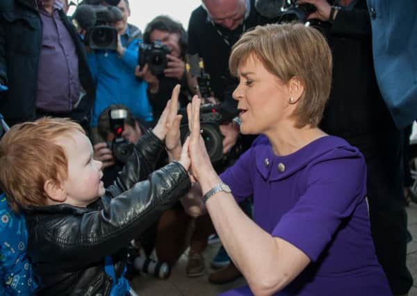 First Minister Nicola Sturgeon meets Andrew Clair on a campaign walkabout in Portobello. Picture: Andrew O'Brien