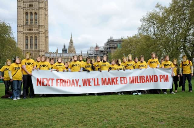 Conservative supporters wearing SNP shirts and Nicola Sturgeon masks. Picture: PA