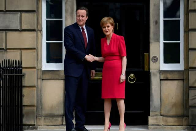 First Minister Nicola Sturgeon greets UK Prime Minister David Cameron at Bute House ahead of devolution talks. Picture: Hemedia