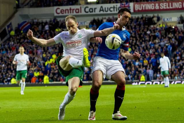 Hibernian's David Gray challenges Lee Wallace for possession. Picture: SNS