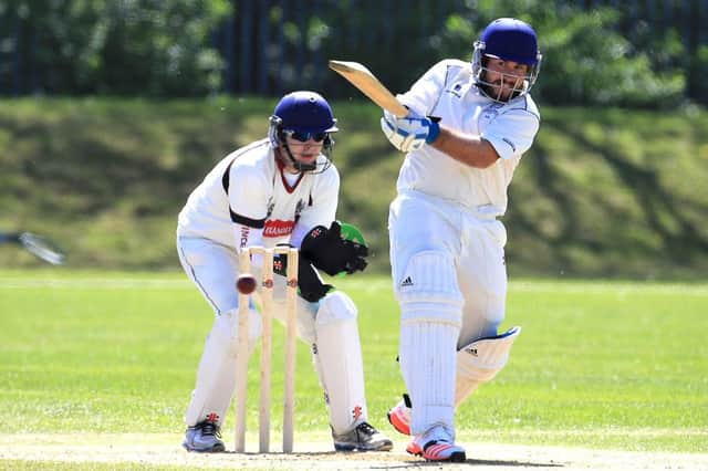 Jake Marnie connects with the ball as Watsonians keeper Andy Hislop looks on. Picture: Gordon Fraser