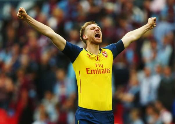 Per Mertesacker celebrates scoring Arsenal's third. Picture: Getty