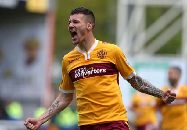 Motherwell's Marvin Johnson celebrates scoring his side's first goal. Picture: PA