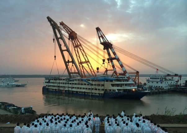 Cranes righted the ship before investigations began. Photograph:AFP/Getty Images