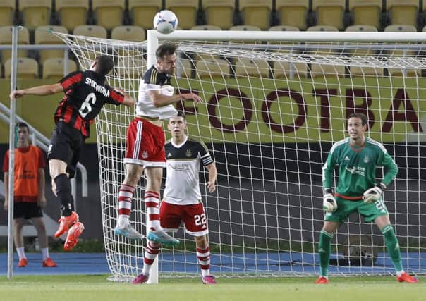 The Dons were unhappy with the home support in Skopje after goalkeeper Danny Ward  had a laser shone in his eyes. Picture: AP