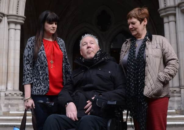 Paul Lamb with Jane Nicklinson, widow of Tony Nicklinson, and her daughter. Picture: PA