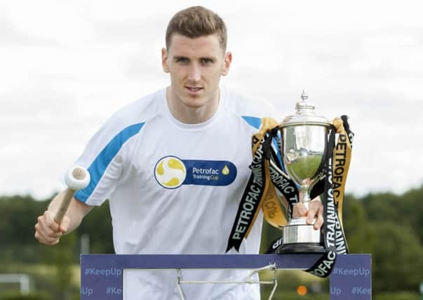 Paul Hanlon signifies the start of the Scottish football season, with Hibs entertaining Rangers at lunchtime today. Picture: SNS