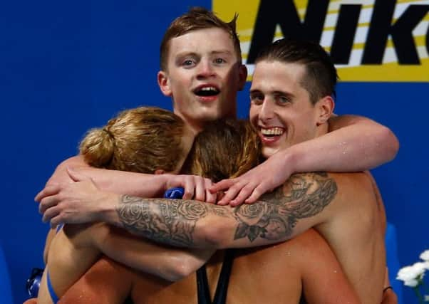 British quartet Adam Peaty, Chris Walker-Hebborn, Siobhan-Marie OConnor and Fran Halsall celebrate winning gold in a world record of 3:41.71 in the mixed 4x100m medley relay final in Kazan. Picture: Getty