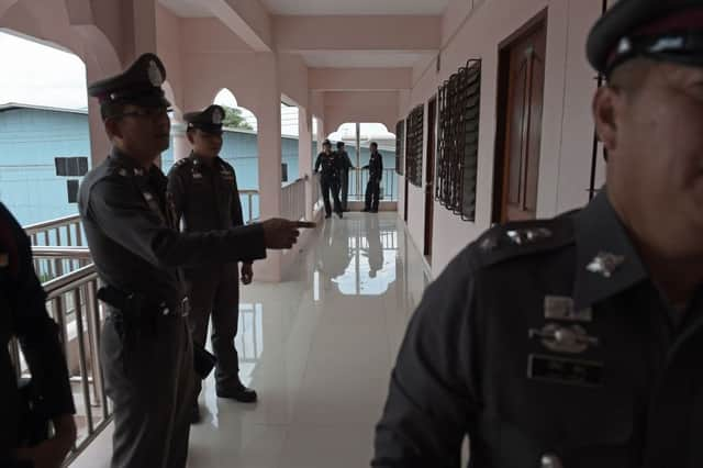 Police conduct a search at apartment blocks on the outskirts of Bangkok. Picture: AFP/GEtty