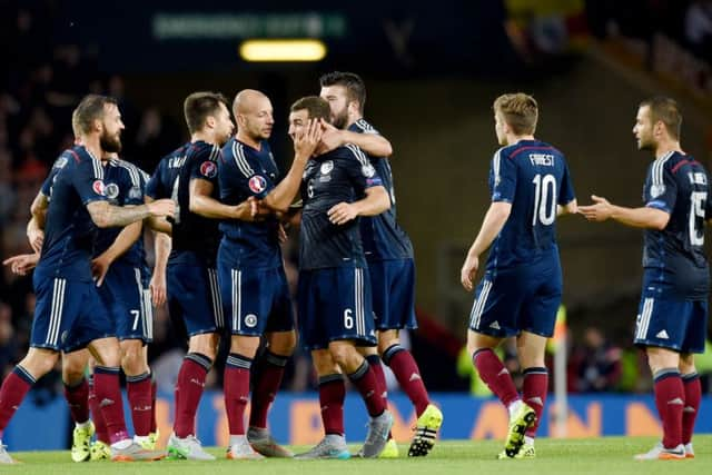 Scotland can be proud of their performance against Germany, while Gordon Strachan hasn't given up hope of reaching Euro 2016. Picture: SNS