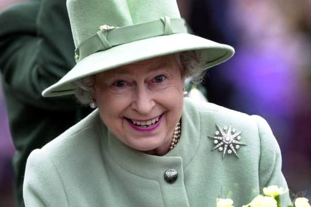 PICTURE EDITORS AWARDS ROYAL PHOTOGRAPHER OF THE YEAR CATEGORY, IAN RUTHERFORD, THE SCOTSMAN., 29/05/02,
Part of a portfolio which won Ian Rutherford the Regional Photographer of the Year Award 2003  in the Guild of Picture Editors Awards
 ROYAL JUBILEE CELEBRATIONS VISIT TO the Borders.  THE QUEEN SEEMS IN GOOD SPIRITS AS SHE RECEIVES A BOUQUET IN THE CENTRE OF MELROSE.   .PIC IAN RUTHERFORD