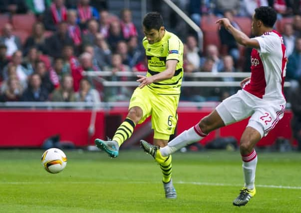 Celtic's Nir Bitton (left) scores past Ajax defender Jairo Riedewald. Picture: AP