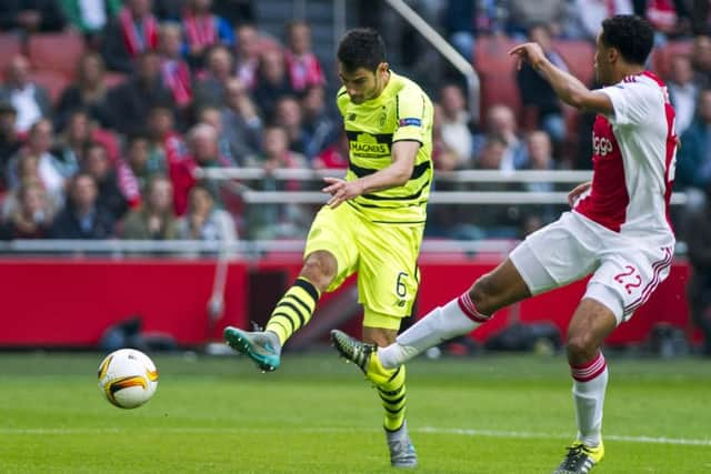 Celtic's Nir Bitton (left) scores past Ajax defender Jairo Riedewald. Picture: AP