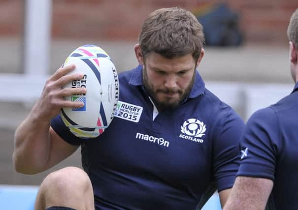 Scotland players form a huddle during the captain's run at Kingsholm yesterday. Picture: Ian Rutherford