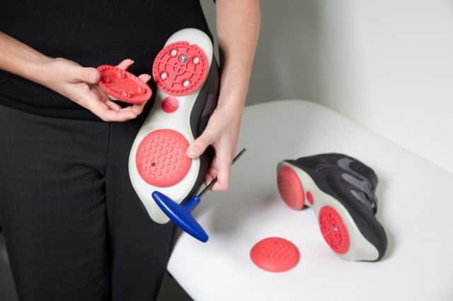 The shoes are adjusted after the patients gait is examined