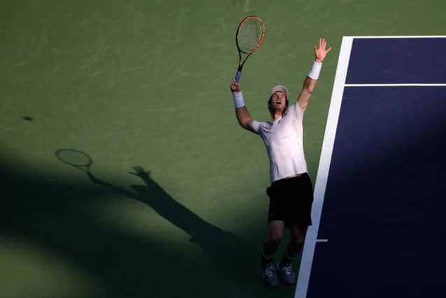 Andy Murray  prepares to serve against John Isner. Picture: AP