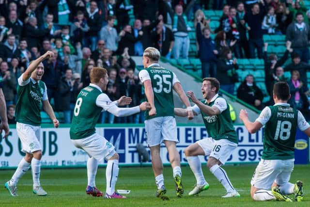 The Hibs players celebrate after taking the lead through Jason Cummings. Picture: Ian Georgeson