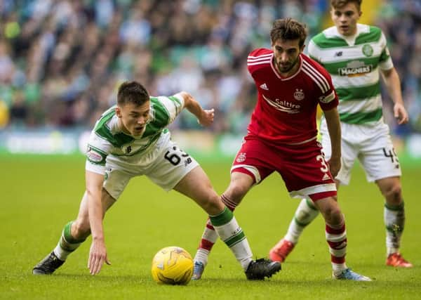 Celtic's Kieran Tierney (left) and Aberdeen's Graeme Shinnie compete for the ball. Picture: PA