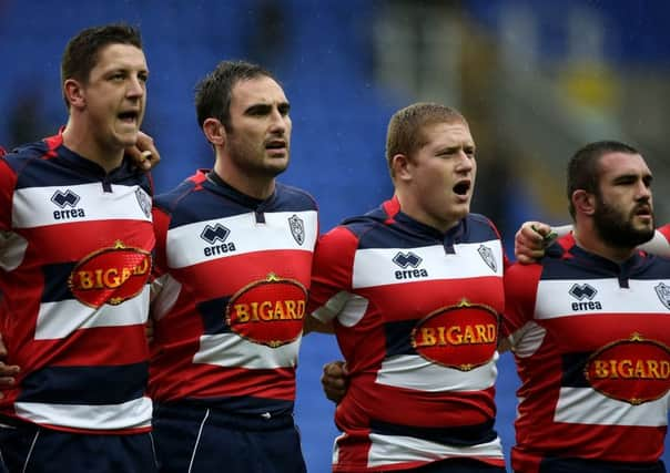 Agen players sing the French national anthem during a minute's silence in memory of the victims of the paris attacks ahead of the European Rugby Challenge Cup match between London Irish and Agen. Picture: Getty