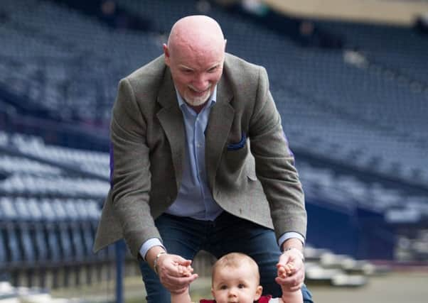 Sir Tom with Yorkhill patient Lucy Hunter, 13 months who has a patient at Yorkhill where she received open heart surgery. Picture: TSPL