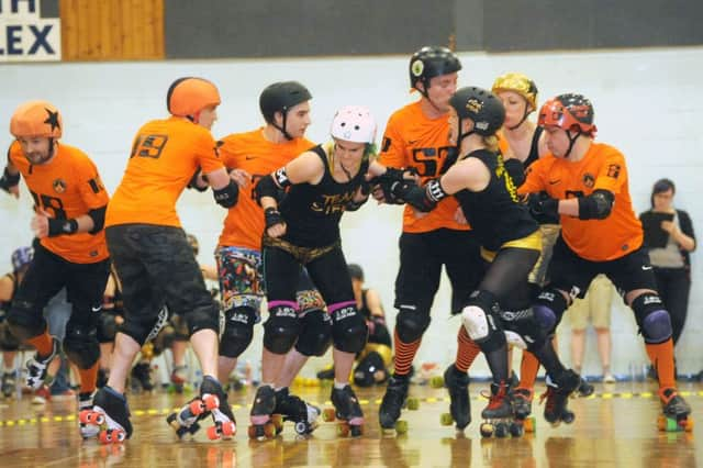 A men v women roller derby match takes place in Grangemouth in 2013. Picture: Lisa Ferguson