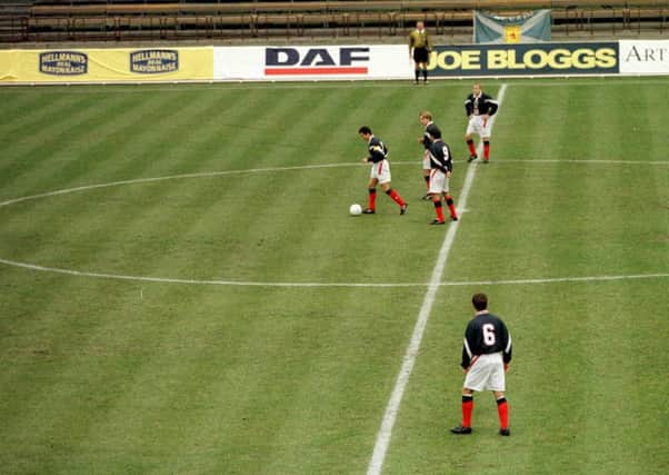 John Collins and Billy Dodds kick off in Talllinn, only for the match to be abandoned after just three seconds. Picture: AllSport