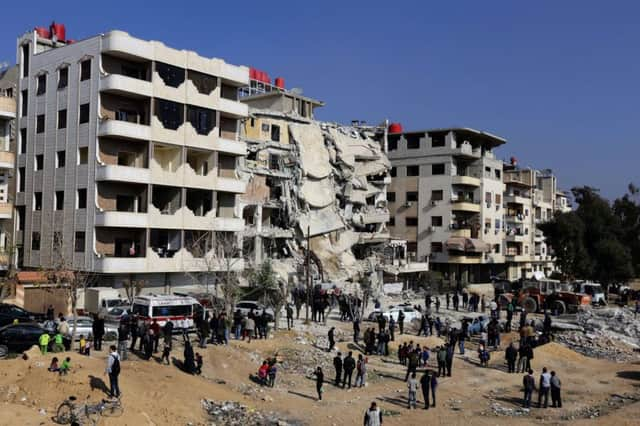 The site of a reported Israeli air raid that killed a senior Hezbollah figure, Samir Kantar, below, in Jaramana, south-east of the Syrian capital. Picture: AFP/Getty