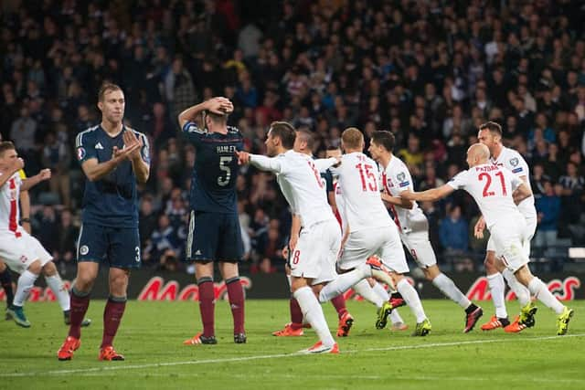 Polish players celebrate after scoring a late equaliser against Scotland at Hampden Park in October. Picture: John Devlin