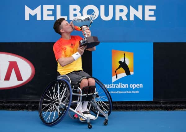 Reid kisses the trophy. Picture: Darrian Traynor/Getty