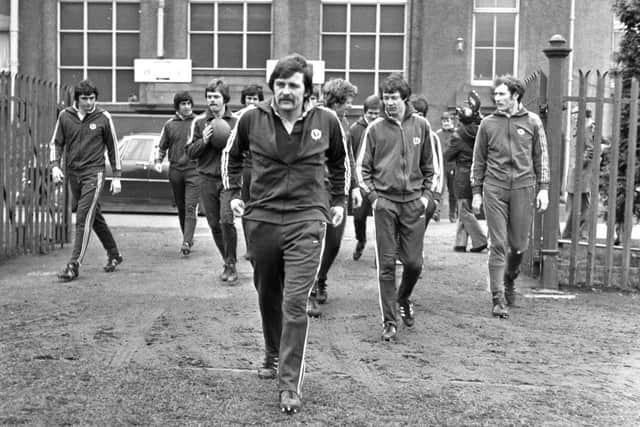 Scotland hooker Colin Fisher is followed to training at Murrayfield by the rest of the squad.