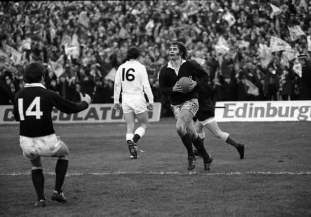 David Leslie is congratulated by team-mate Billy Steele after scoring Scotland's second try against England.