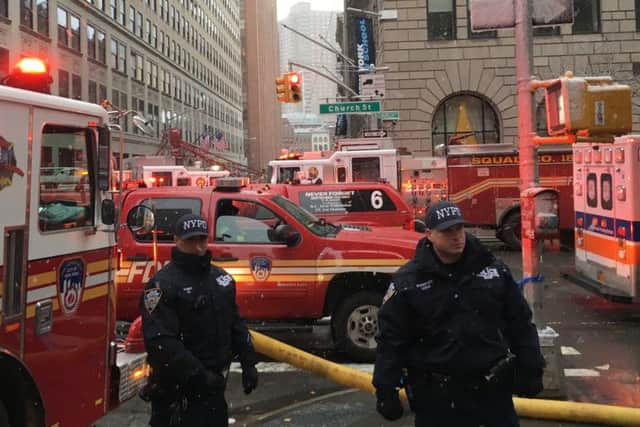 Emergency workers gather at the scene of a crane collapse in the Tribeca section of Manhattan in New York on Friday. Picture: AP