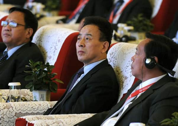 Wei Hong, centre, attends the opening ceremony of an agriculture expo in Chengdu in southwest China's Sichuan province in November. Picture: AP