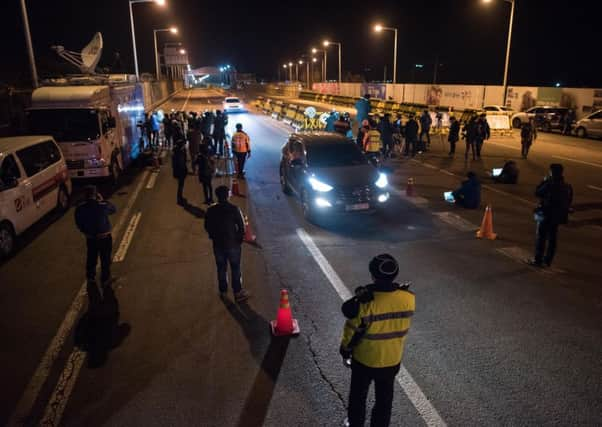 South Korean media on the Tongil bridge at the Demilitarized Zone leading to Kaesong. Picture: AFP/Getty Images