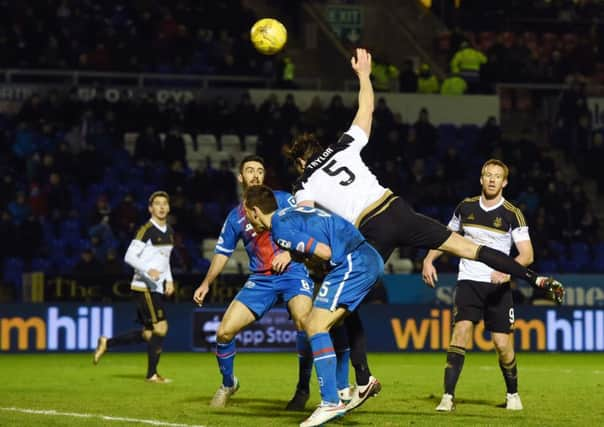 Aberdeen's Ash Taylor just prior to being booked for deliberate handball. Picture: SNS