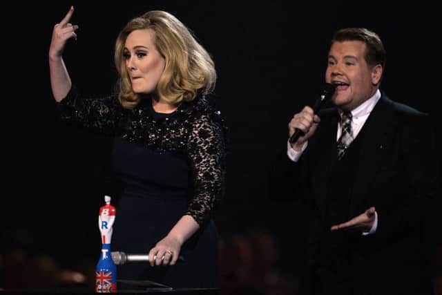 An unimpressed Adele collecting her award for Album of the Year during the 2012 ceremony. Picture: PA