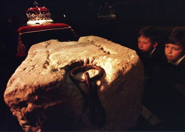 Two children look at the Stone of Destiny at Edinburgh Castle. Picture: Neil Hanna