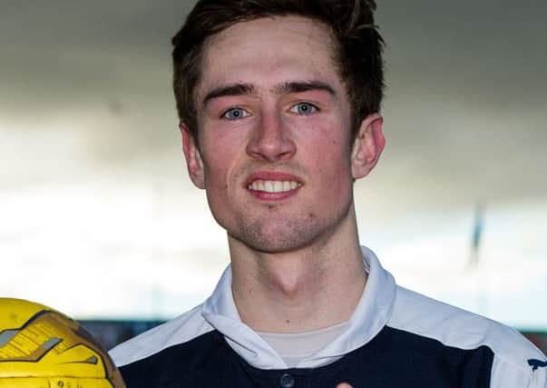 Raith's Ryan Hardie celebrates his hat-trick with the match ball at full time. Picture: SNS