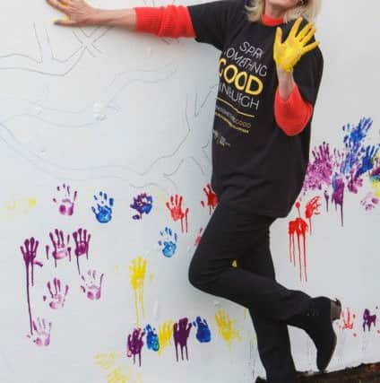 Joanna Lumley visits Oxgangs Neighbouhood Centre, Edinburgh, to help out in the garden. Picture: Toby Williams