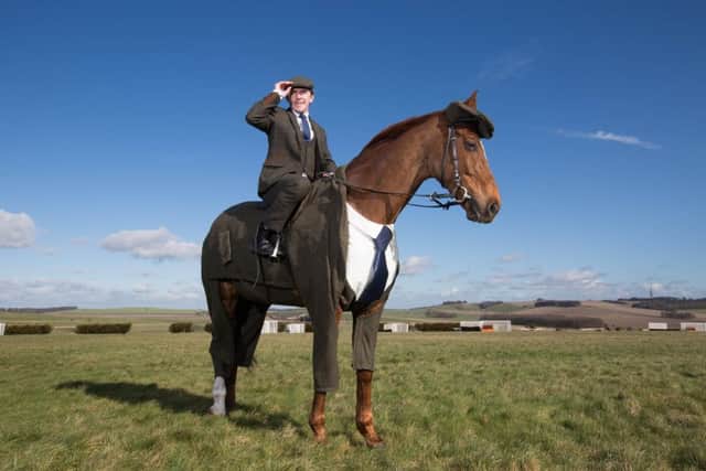 Morestead and Sir Tony McCoy model the hand-crafted tweed suit, which was commissioned to celebrate the Cheltenham Festival. Picture: PA