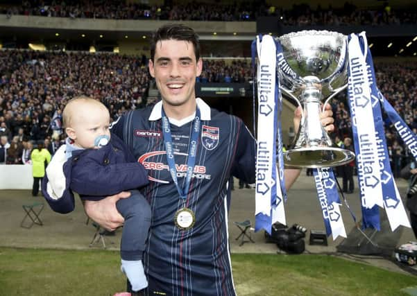 Brian Graham celebrates after helping Ross County to win the League Cup. Picture: SNS