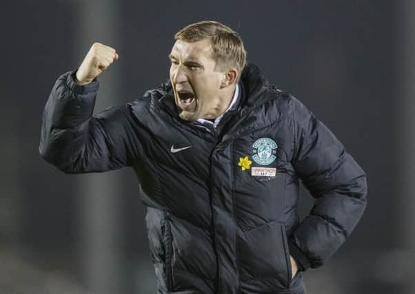 Alan Stubbs celebrates after Hibs finally got back to winning ways. Picture: Steve Welsh