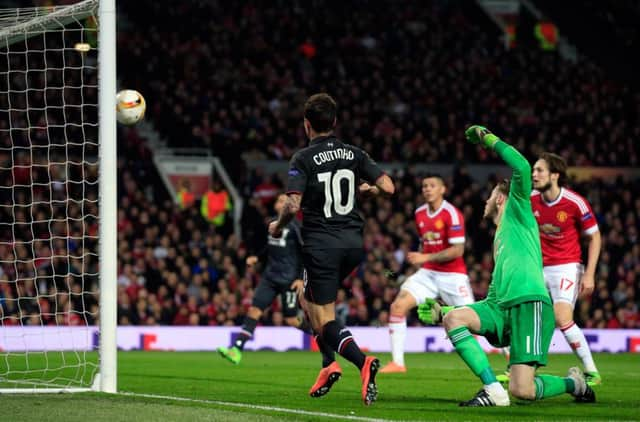 Liverpools Philippe Coutinho scores his sides goal at Old Trafford with a delicate chipped finish. Picture: AP