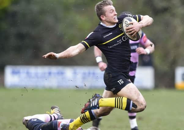 Ayrs David Armstrong, left, tackles Tom Galbraith as the home side gave away little.  Picture: Paul Devlin/SNS