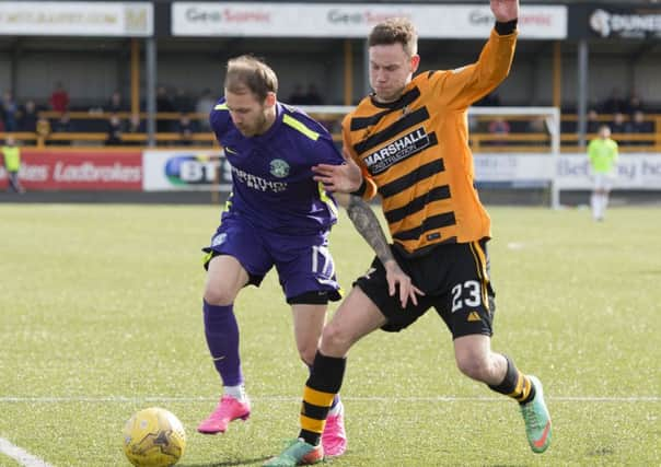 Martin Boyle (left) and Alloa's Mitch Megginson. Picture: SNS Group